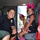 These kids, their eyes on a possible future with the Lemoore Volunteer Fire Department, take a closer look at the inside of a fire truck at Sunday's MIQ Fall Festival.